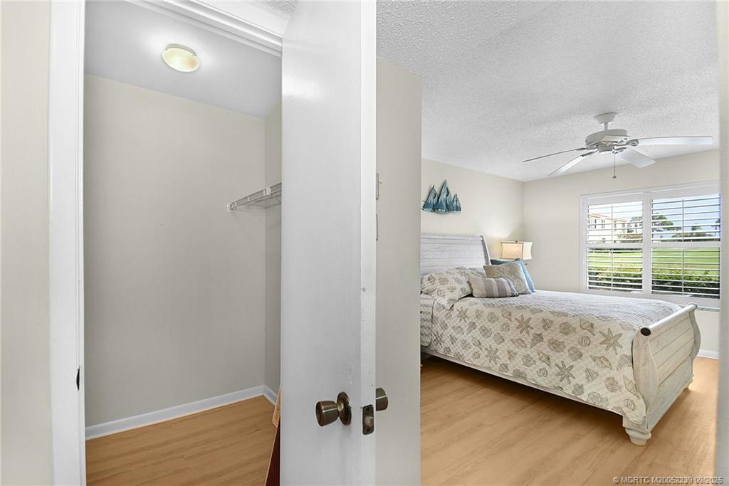 5313 Southeast Miles Grant Road, Unit 102 Stuart, FL 34997 - Photo 21 of 48 a bedroom with a bed and window