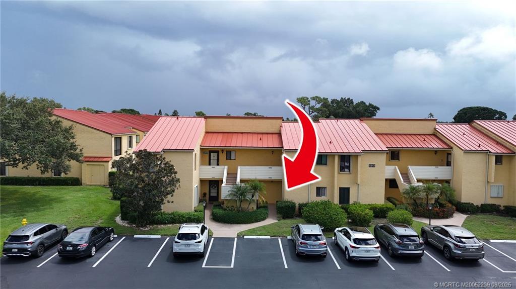 5313 Southeast Miles Grant Road, Unit 102 Stuart, FL 34997 - Photo 22 of 48 a sign that is sitting in front of a house