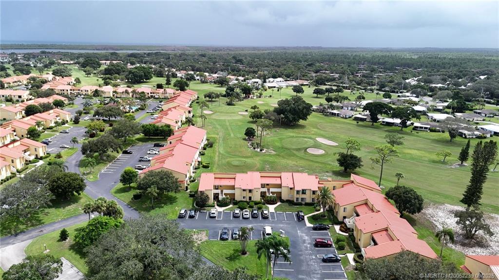 5313 Southeast Miles Grant Road, Unit 102 Stuart, FL 34997 - Photo 24 of 48 an aerial view of residential houses with outdoor space and river