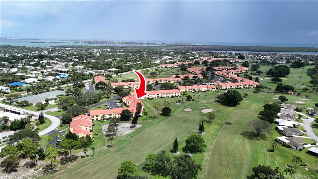 5313 Southeast Miles Grant Road, Unit 102 Stuart, FL 34997 - Photo 28 of 48 an aerial view of a houses with a yard