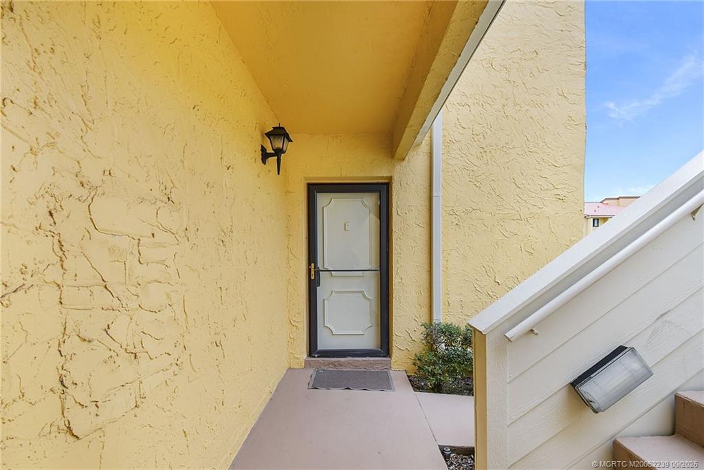 5313 Southeast Miles Grant Road, Unit 102 Stuart, FL 34997 - Photo 3 of 48 a view of a entryway