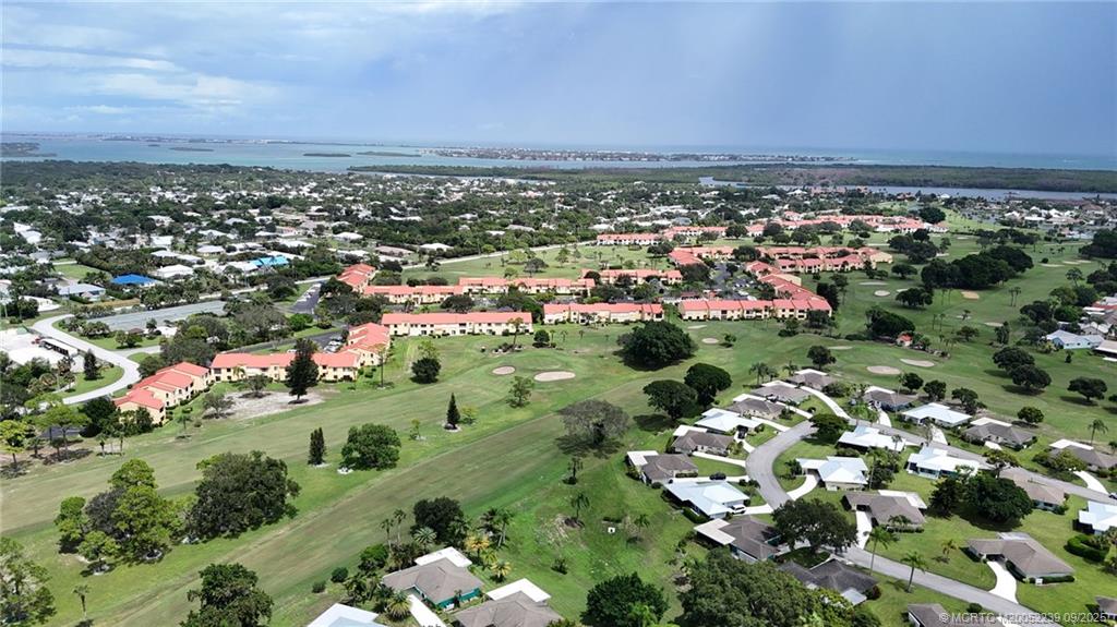 5313 Southeast Miles Grant Road, Unit 102 Stuart, FL 34997 - Photo 31 of 48 an aerial view of multiple house