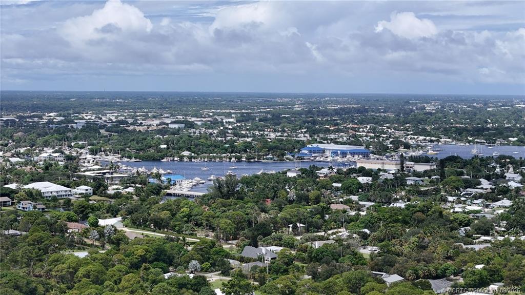 5313 Southeast Miles Grant Road, Unit 102 Stuart, FL 34997 - Photo 33 of 48 an aerial view of multiple house