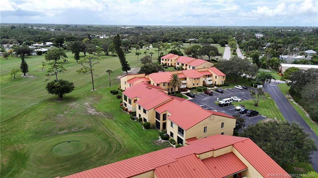 5313 Southeast Miles Grant Road, Unit 102 Stuart, FL 34997 - Photo 43 of 48 an aerial view of residential houses with outdoor space