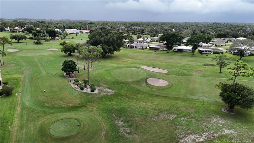 5313 Southeast Miles Grant Road, Unit 102 Stuart, FL 34997 - Photo 45 of 48 a view of a golf course with a area