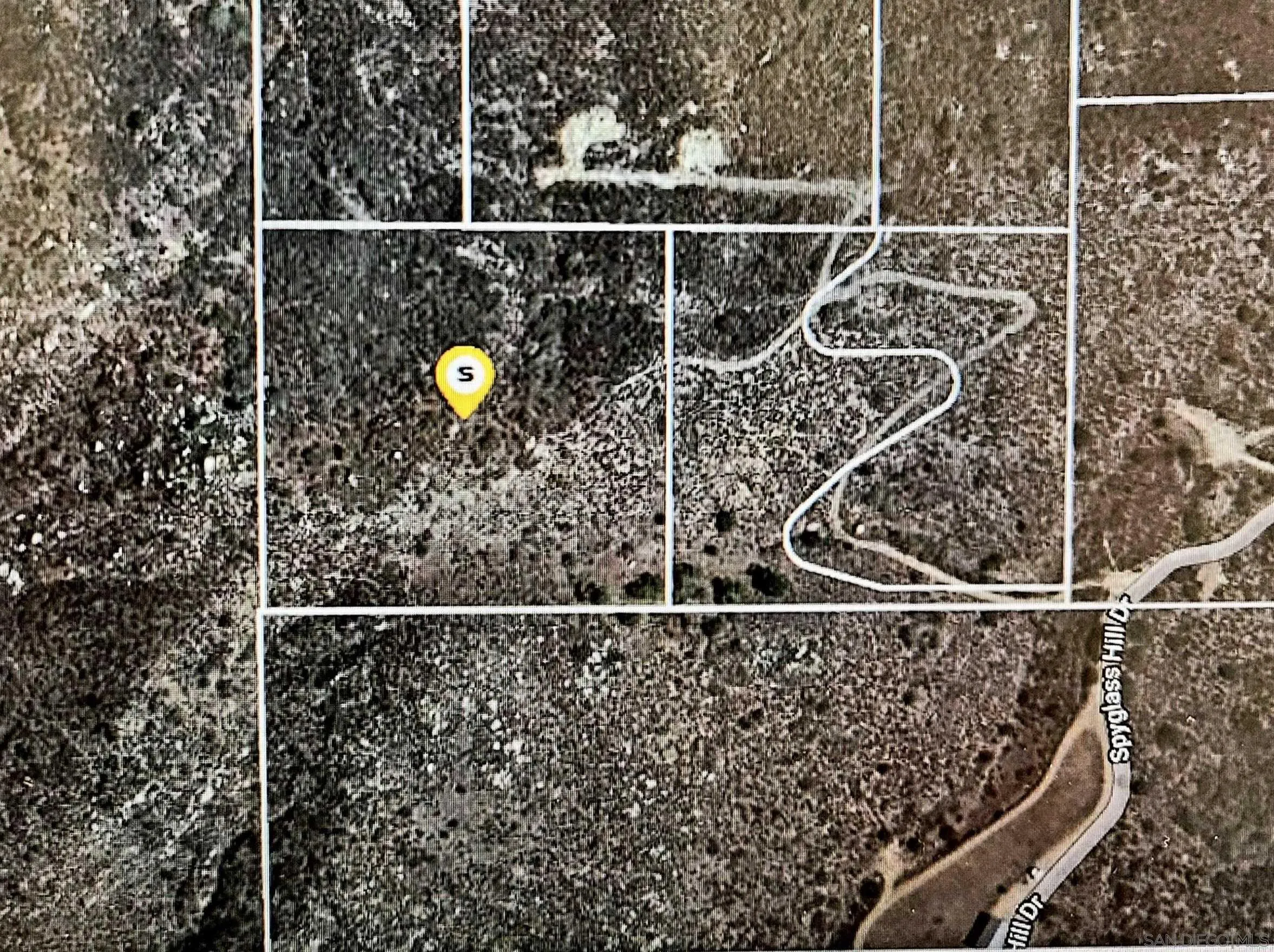 a bathroom with a mirror and a shower