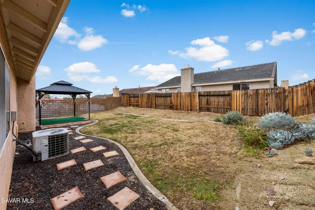 an aerial view of residential houses with city view