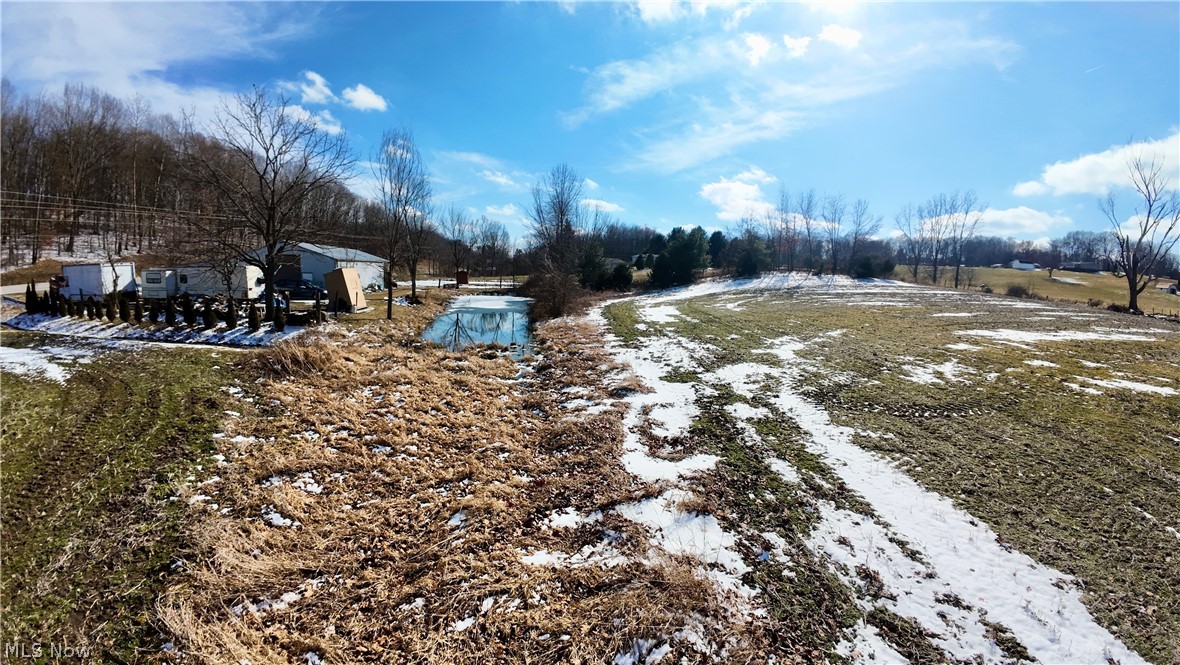 60 State Route Millersburg, OH 44654 - Photo 6 of 12 Yard layered in snow featuring a patio