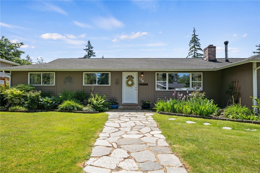 128 183rd Street Southwest Bothell, WA 98012 - Photo 2 of 33 a front view of a house with garden