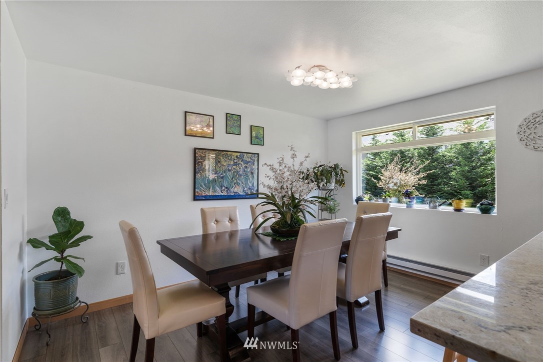 128 183rd Street Southwest Bothell, WA 98012 - Photo 11 of 33 a view of a dining room with furniture window and wooden floor