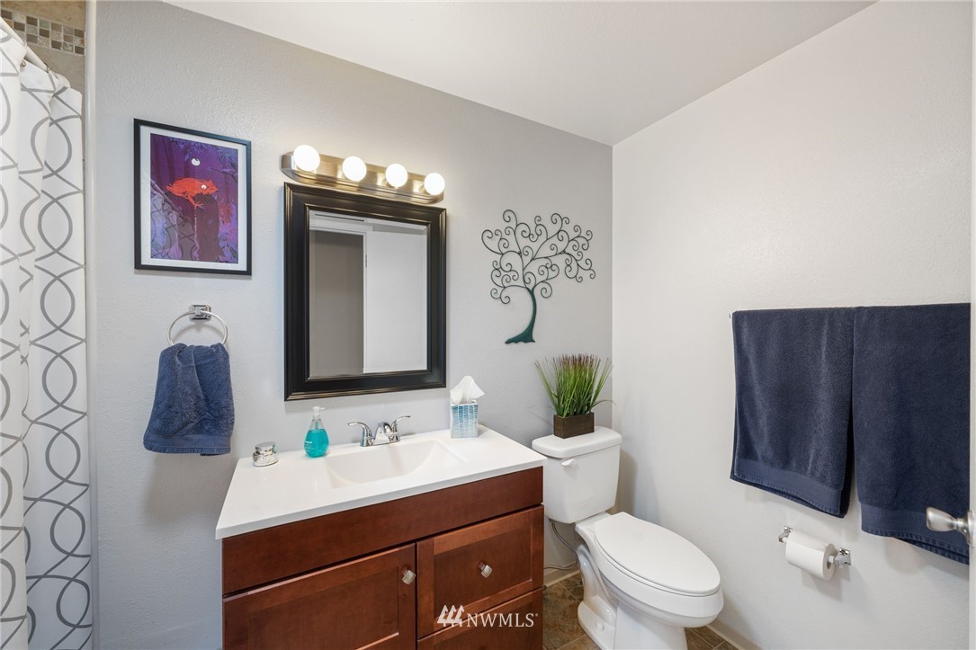 128 183rd Street Southwest Bothell, WA 98012 - Photo 13 of 33 a bathroom with a toilet a sink and mirror