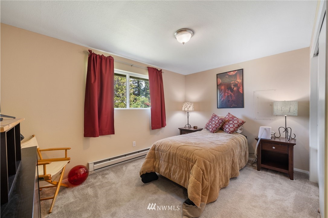 128 183rd Street Southwest Bothell, WA 98012 - Photo 14 of 33 a bedroom with a bed and a window