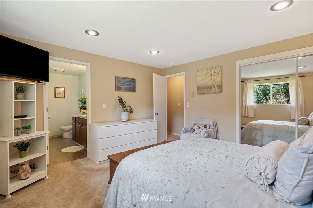 128 183rd Street Southwest Bothell, WA 98012 - Photo 16 of 33 a bedroom with a bed and a flat screen tv
