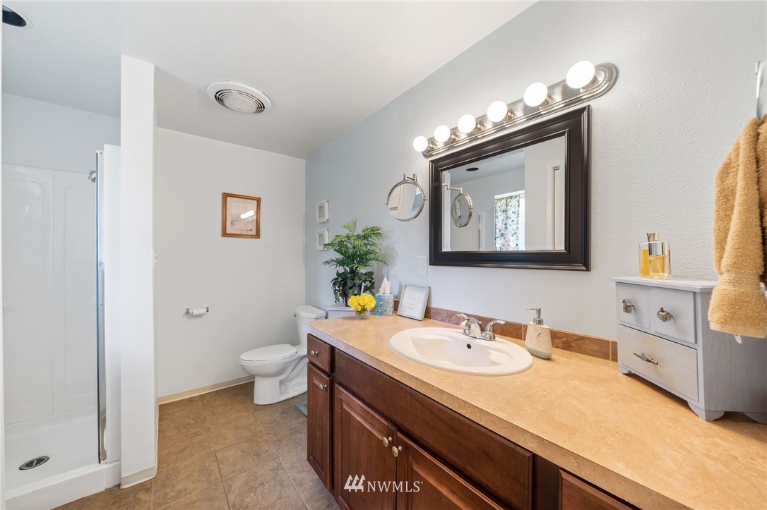 128 183rd Street Southwest Bothell, WA 98012 - Photo 17 of 33 a bathroom with a sink vanity and a mirror