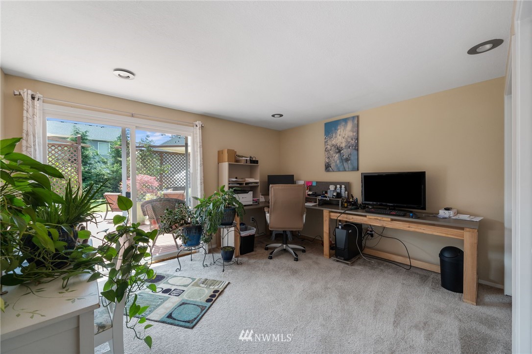128 183rd Street Southwest Bothell, WA 98012 - Photo 19 of 33 a living room with furniture a potted plant and a large window