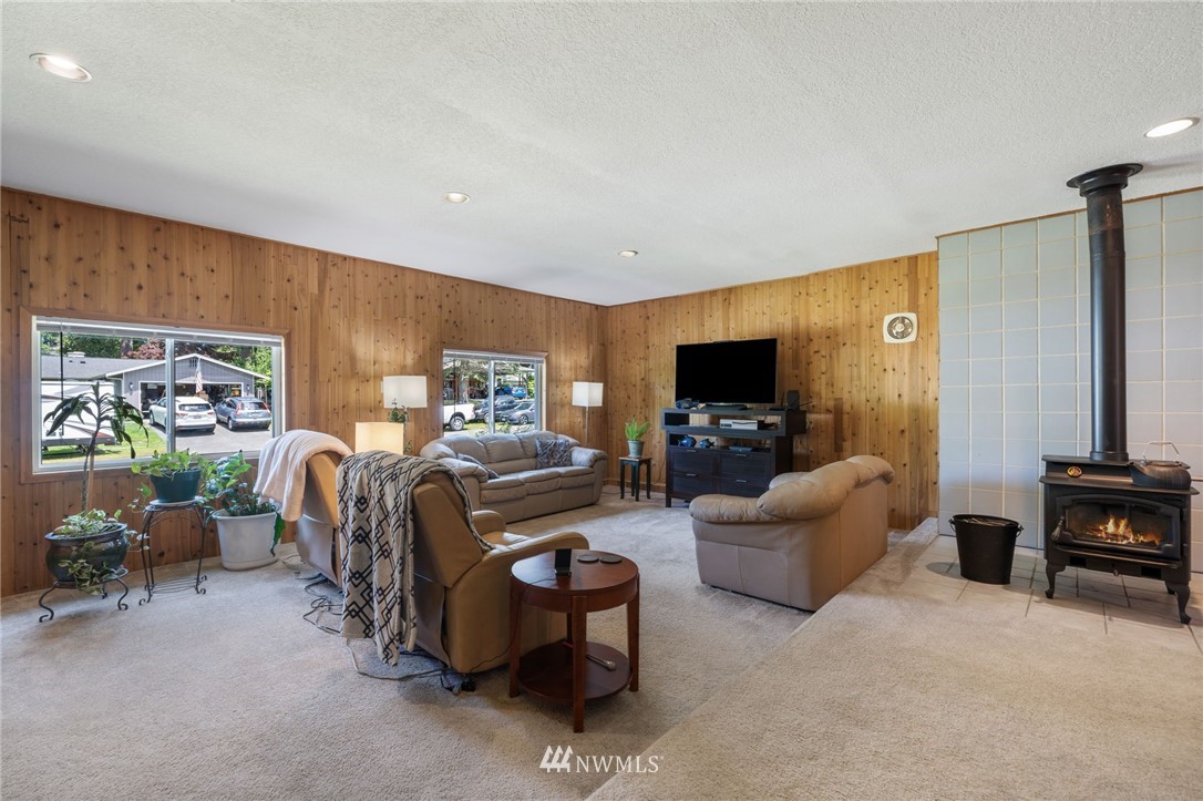 128 183rd Street Southwest Bothell, WA 98012 - Photo 22 of 33 a living room with furniture and a flat screen tv