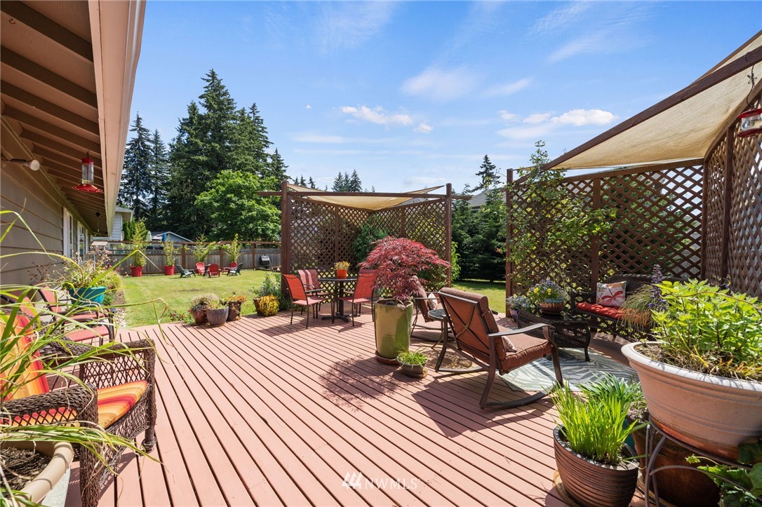 128 183rd Street Southwest Bothell, WA 98012 - Photo 24 of 33 a view of a patio with couches table and chairs and potted plants