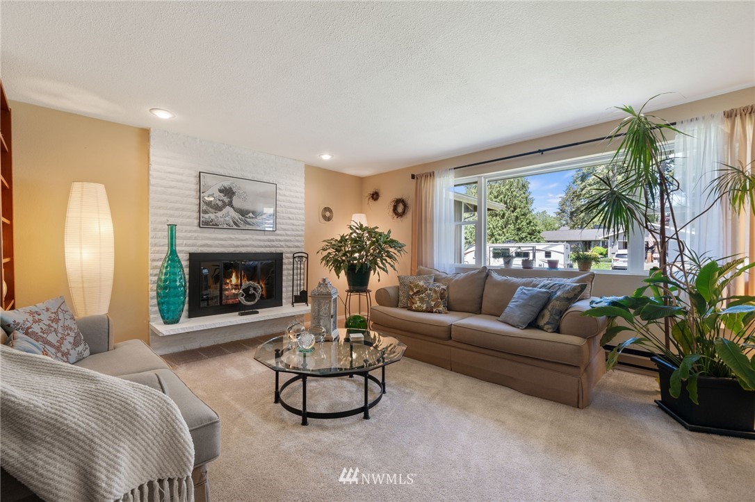 128 183rd Street Southwest Bothell, WA 98012 - Photo 4 of 33 a living room with furniture and a fireplace