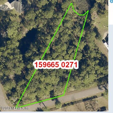 a street sign that is on a tree