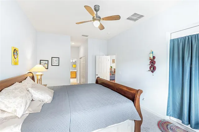 a bedroom with furniture and a window