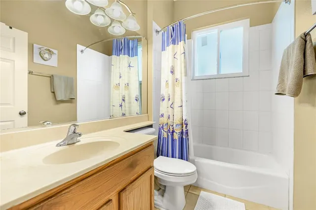 a bathroom with a sink a toilet and a bathtub