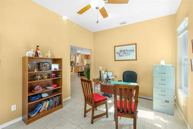 a view of a dining room with furniture and window