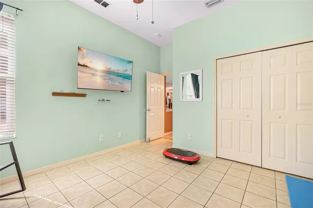 a bedroom with a bed and a table