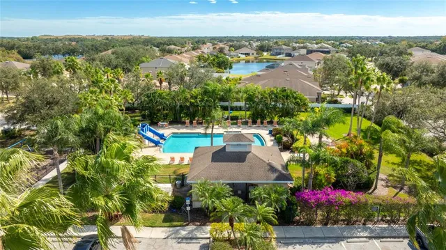 a view of a swimming pool with an outdoor space and seating area