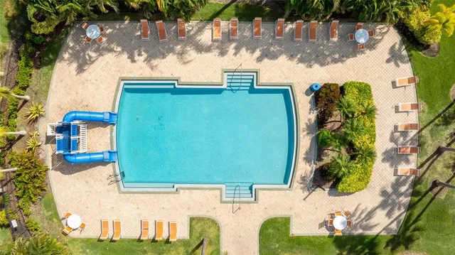 a view of a swimming pool with a patio