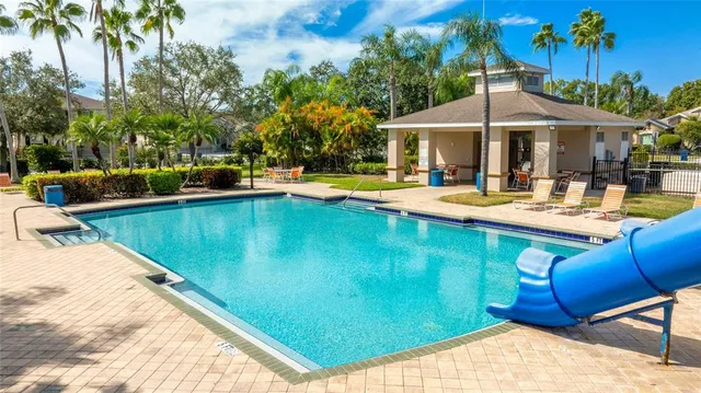 a view of a swimming pool with a lounge chairs