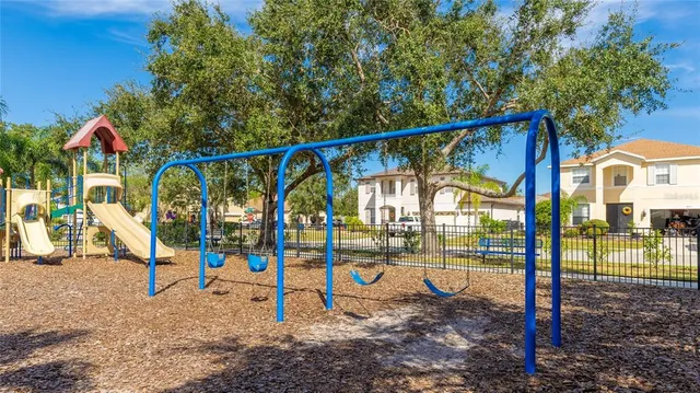 an outdoor space with furniture and umbrella