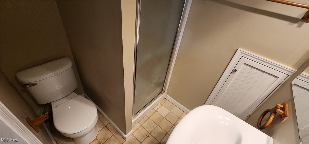 4161 Lambert Road Cleveland, OH 44121 - Photo 10 of 18 Bathroom with toilet and a shower with door