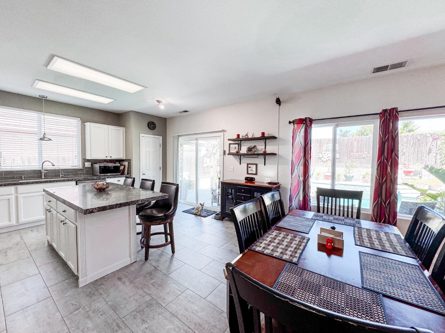 2457 Carson Avenue Clovis, CA 93611 - Photo 12 of 33 a living room with furniture and a open window