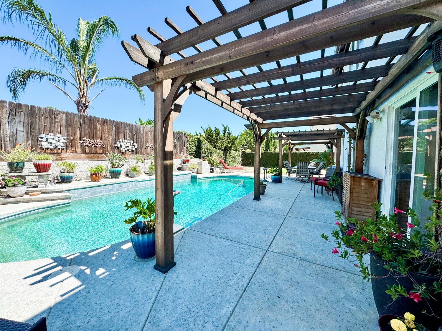 2457 Carson Avenue Clovis, CA 93611 - Photo 27 of 33 a view of a porch with potted plants