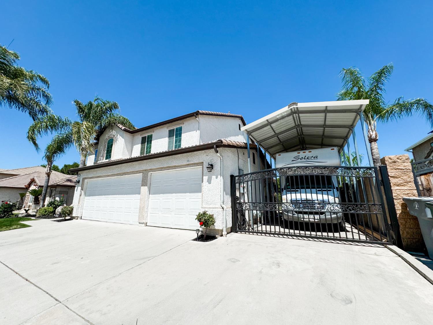2457 Carson Avenue Clovis, CA 93611 - Photo 3 of 33 a front view of a house with parking