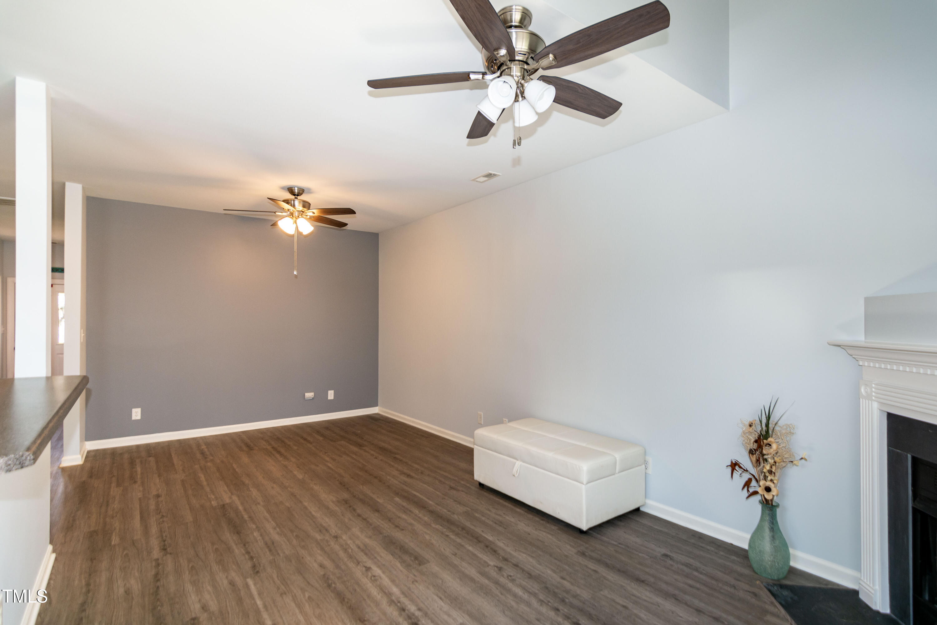 2638 Andover Glen Road Raleigh, NC 27604 - Photo 14 of 49 an empty room with wooden floor and ceiling fan