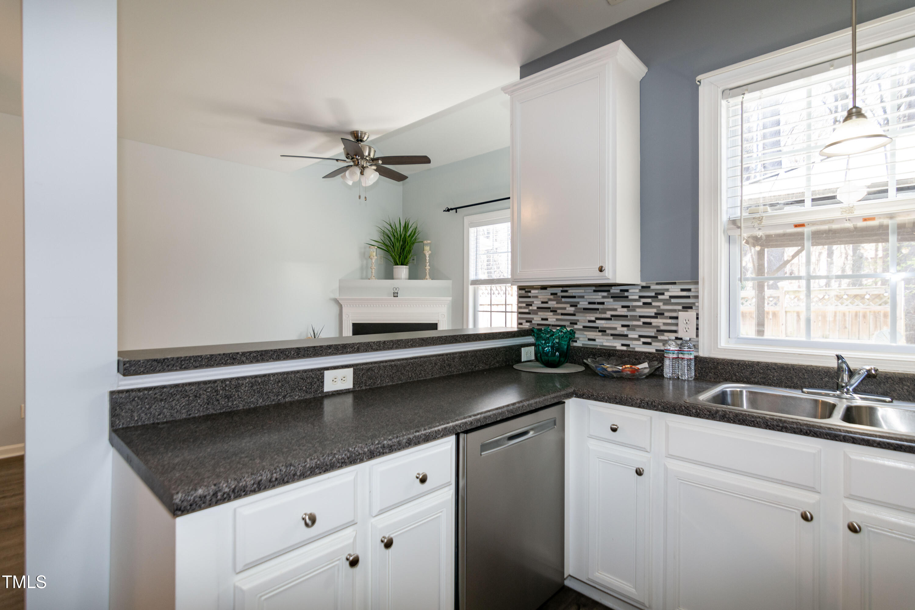 2638 Andover Glen Road Raleigh, NC 27604 - Photo 20 of 49 a kitchen with granite countertop a sink cabinets and window