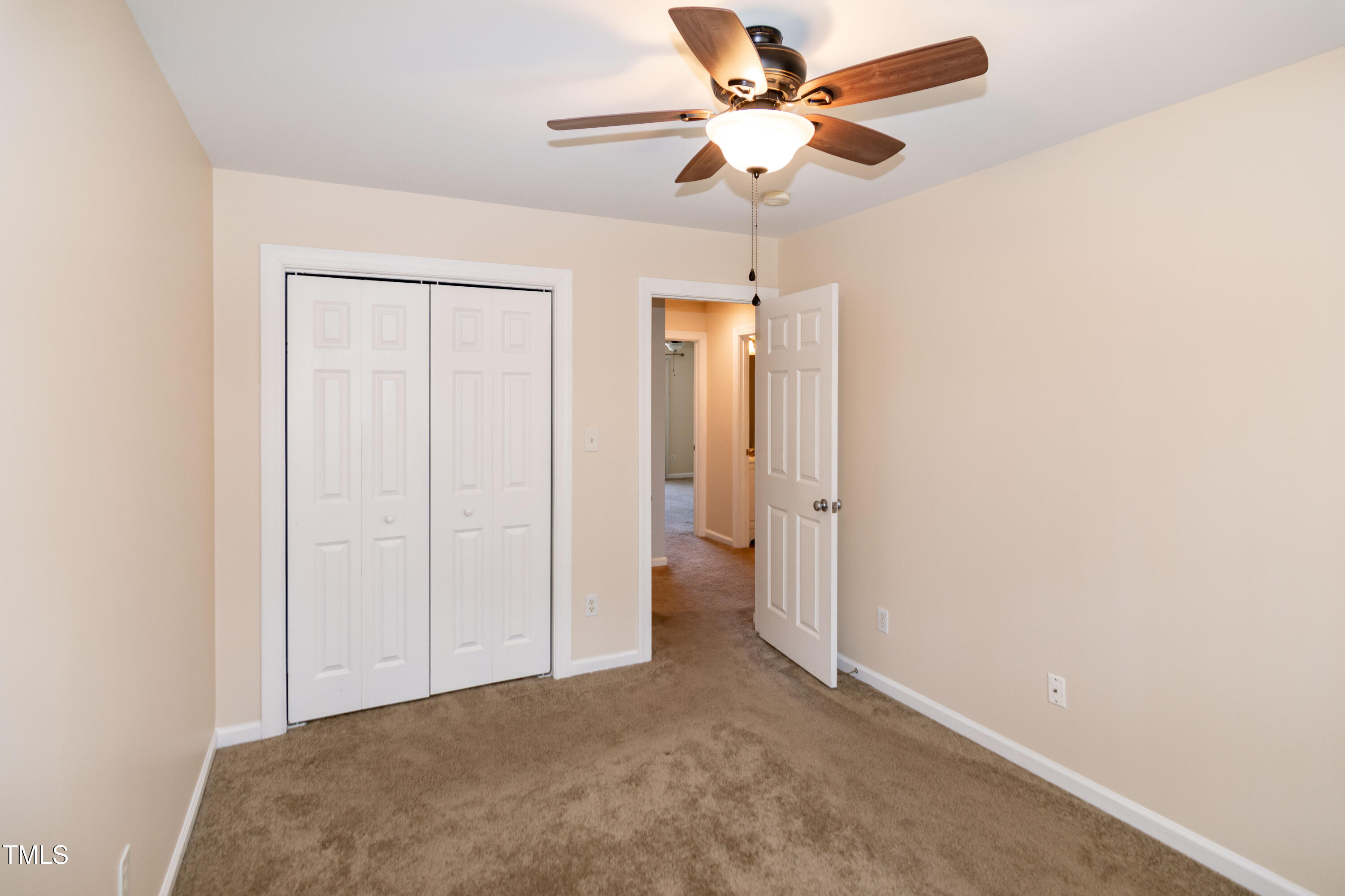 2638 Andover Glen Road Raleigh, NC 27604 - Photo 36 of 49 an empty room with a empty space and a ceiling fan