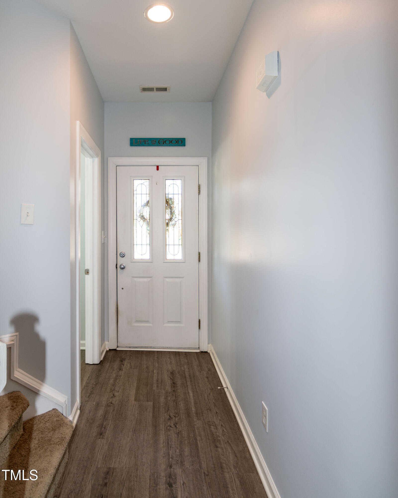 2638 Andover Glen Road Raleigh, NC 27604 - Photo 8 of 49 an empty room with wooden floor and windows