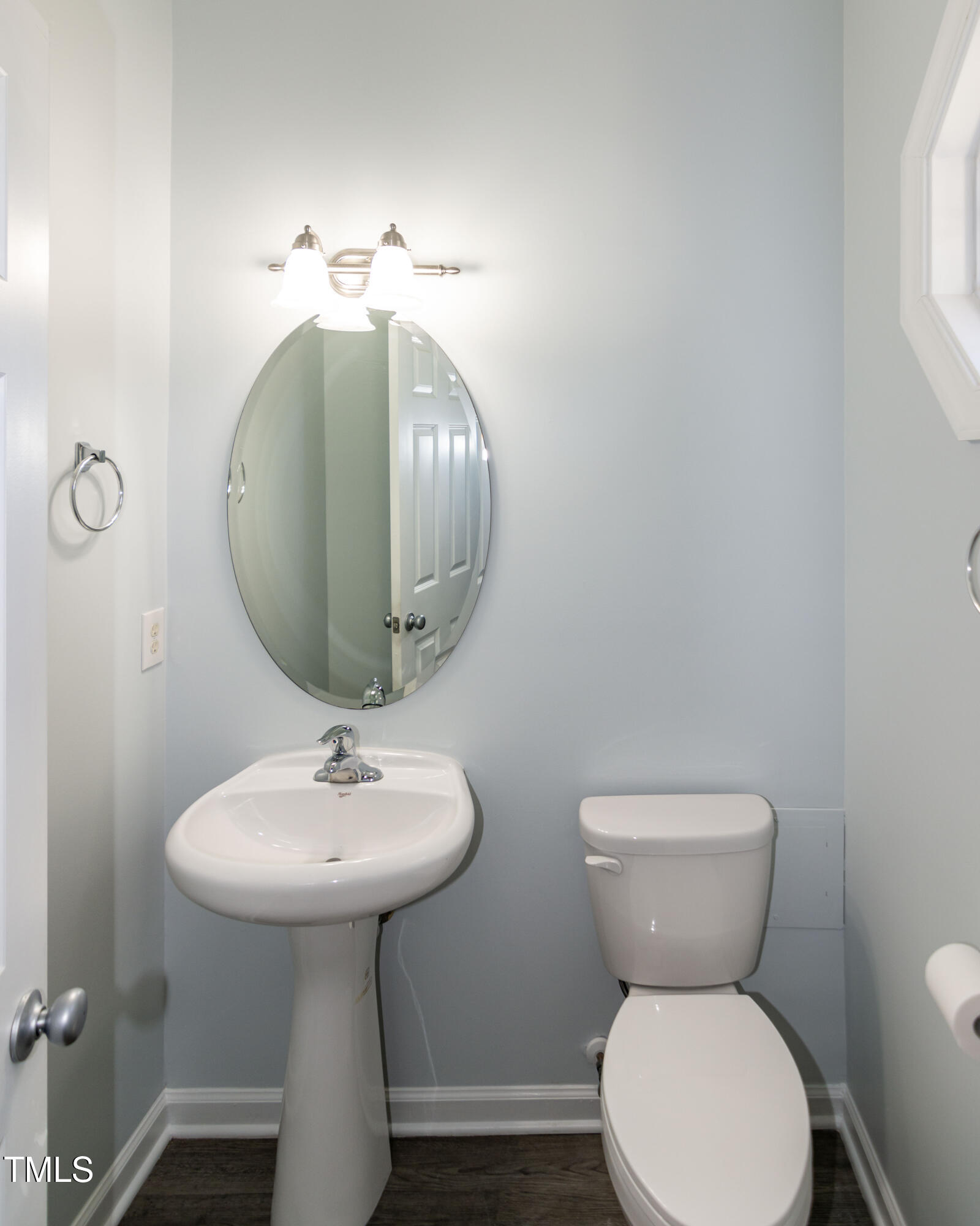 2638 Andover Glen Road Raleigh, NC 27604 - Photo 9 of 49 a bathroom with a toilet sink and mirror
