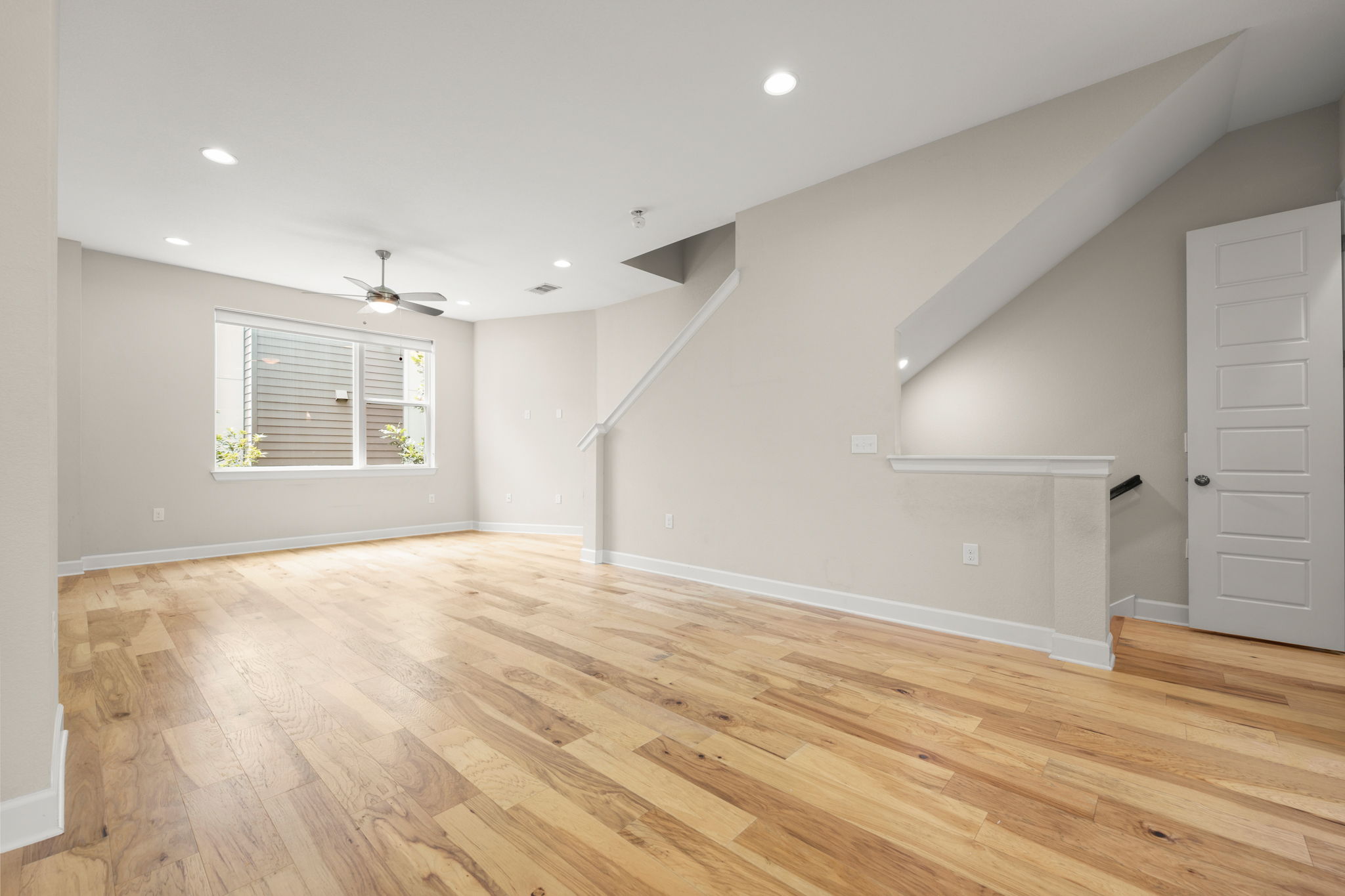 4403 Swift Path Austin, TX 78741 - Photo 10 of 32 Spacious interior featuring wood-finish flooring, recessed lighting, and a ceiling fan