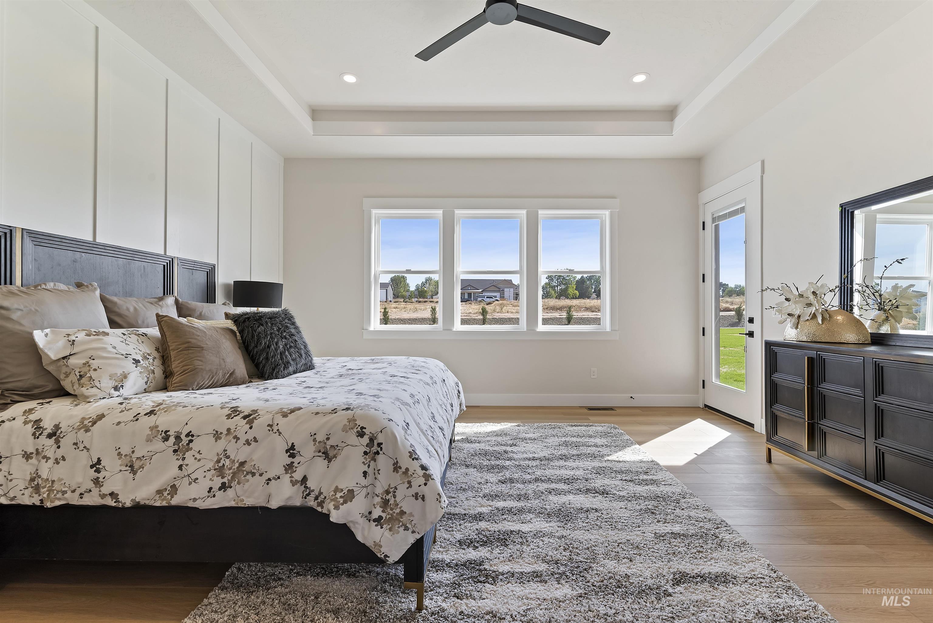 24864 Ardmore Court Caldwell, ID 83607 - Photo 22 of 48 Bedroom with multiple windows, light wood-type flooring, access to outside, recessed lighting, and a ceiling fan