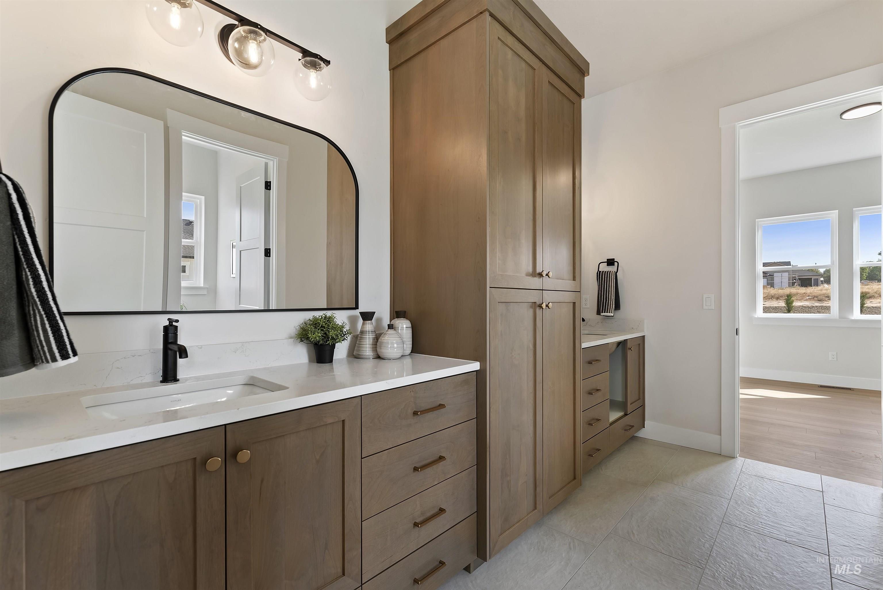 24864 Ardmore Court Caldwell, ID 83607 - Photo 29 of 48 Bathroom featuring vanity and light tile patterned flooring