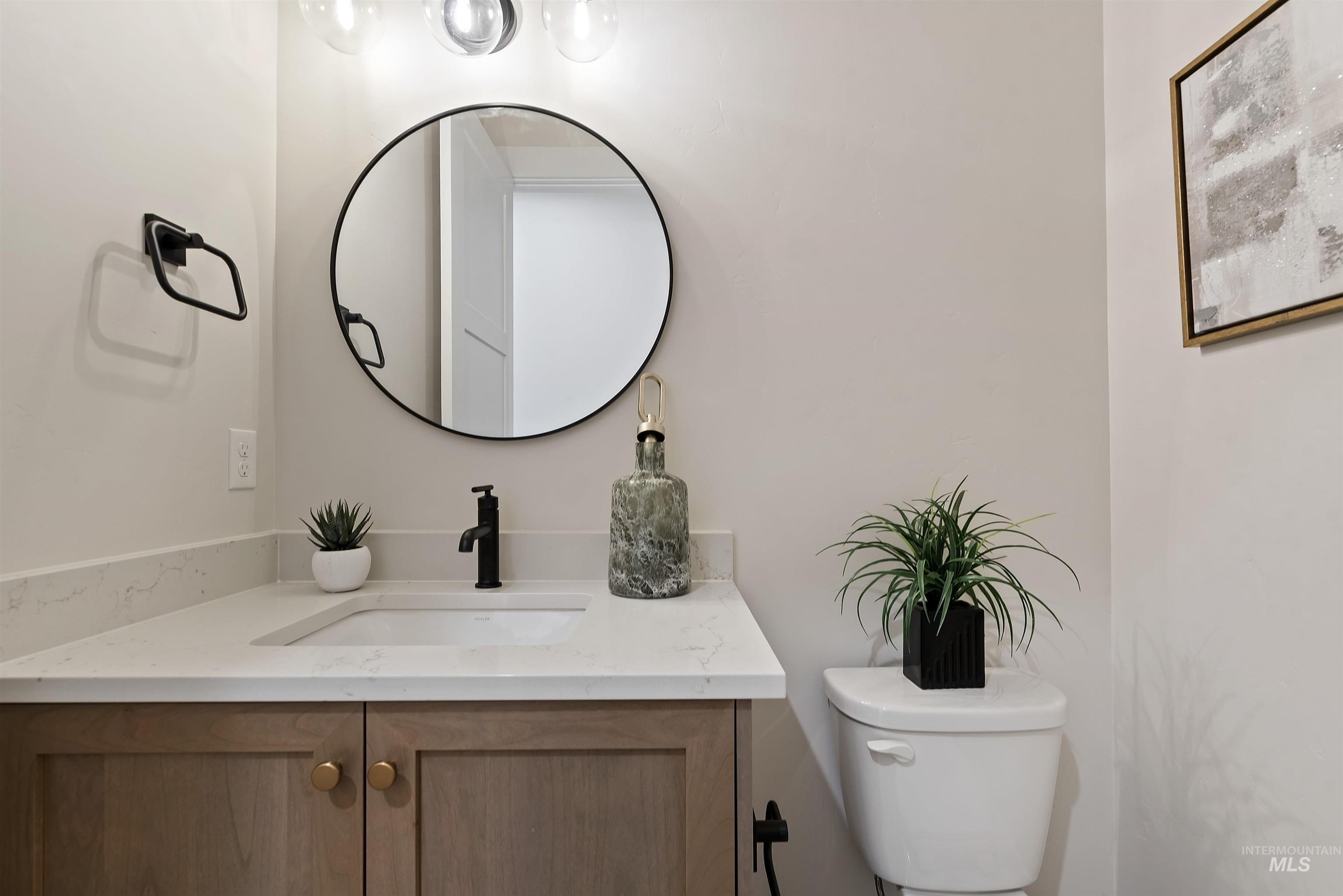 24864 Ardmore Court Caldwell, ID 83607 - Photo 37 of 48 Half bath with vanity and toilet