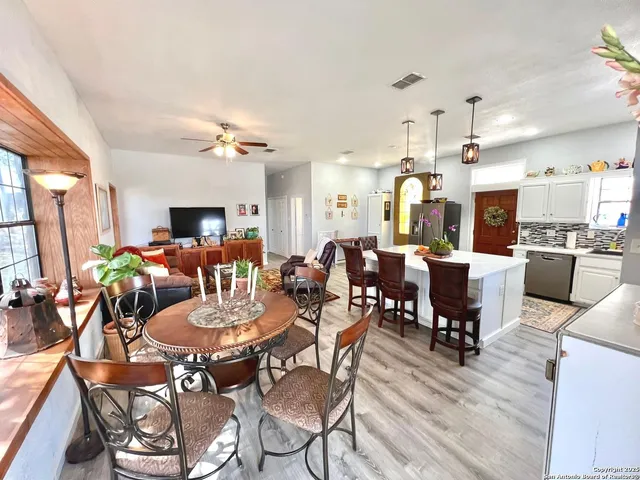 a view of a dining area with furniture window and wooden floor