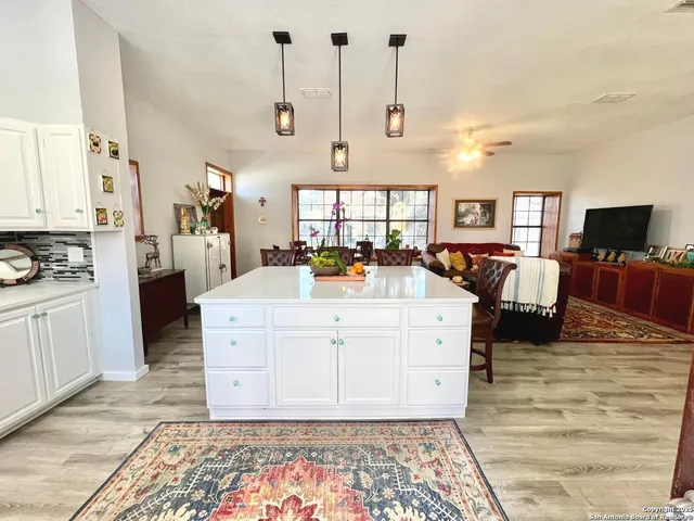 a view of living room with furniture and flat screen tv