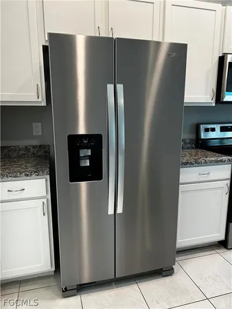 a refrigerator freezer sitting in a kitchen