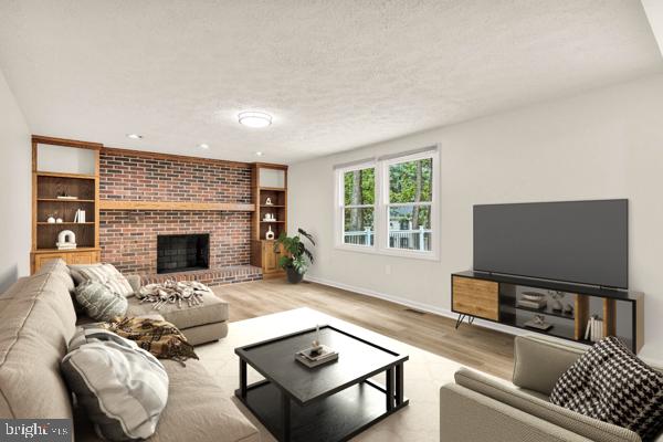 10640 Gorman Road Laurel, MD 20723 - Photo 3 of 25 a living room with furniture and a flat screen tv