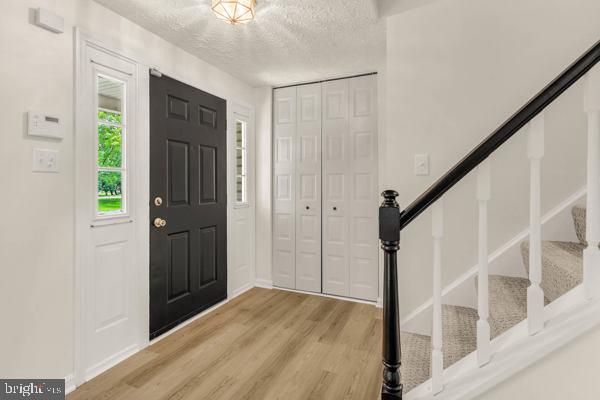 10640 Gorman Road Laurel, MD 20723 - Photo 5 of 25 a view of a hallway with wooden floor and staircase