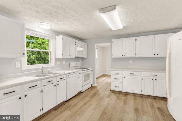 10640 Gorman Road Laurel, MD 20723 - Photo 8 of 25 a large kitchen with cabinets and wooden floor